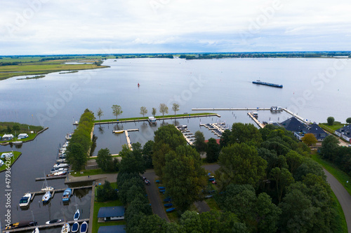 Aerial view of the Wolderwijk lake with small green islands that offer shelter to various species of fish and birds. Dutch province of Flevoland, Netherlands. photo