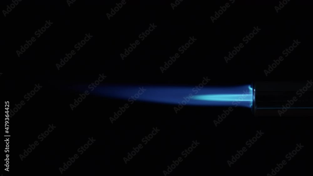 Butane Gas Flame and nozzle against black from a butane torch burner. Blue and yellow flame. Element for VFX and Compositing, e.g. as rocket propulsion, spaceship drive or welding flame