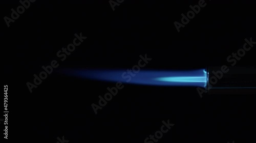 Butane Gas Flame and nozzle against black from a butane torch burner. Blue and yellow flame. Element for VFX and Compositing, e.g. as rocket propulsion, spaceship drive or welding flame photo