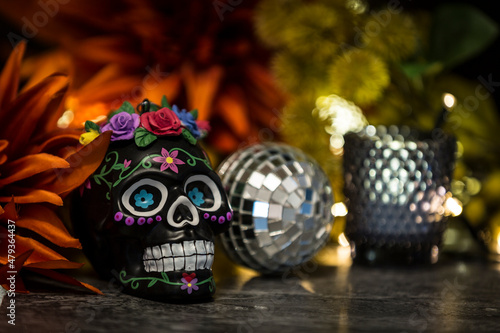 The day of the dead skull with small mirror ball and drinking glass
