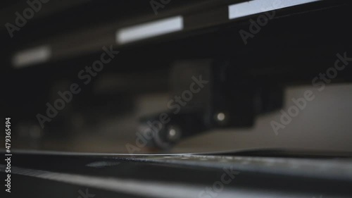 Industrial plotter for cuttering paper in print shop. Modern commercial equipment in work, professional factory 