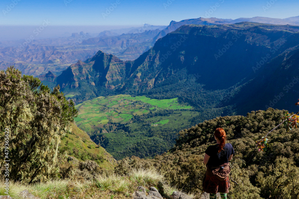 White Woman Tourist looking at the Green Valley of Simien Mountains near Gondar, Northern Ethiopia