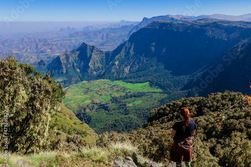 White Woman Tourist looking at the Green Valley of Simien Mountains near Gondar, Northern Ethiopia