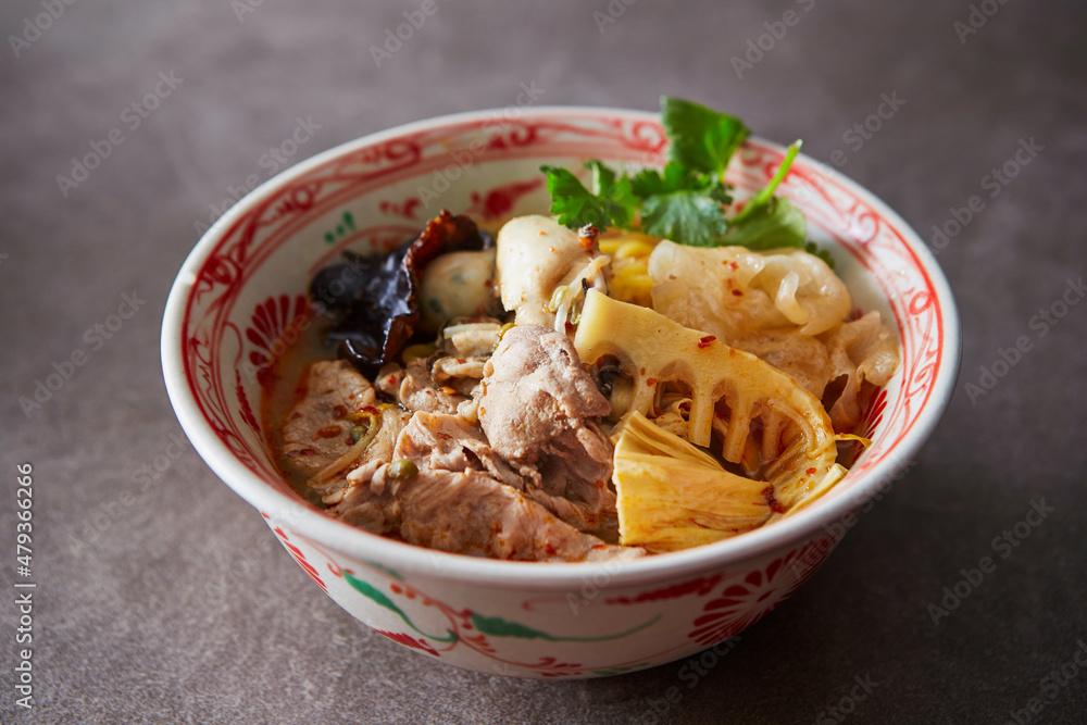 Malatang, skewered vegetables and meat cooked in a hot and spicy soup Malatang, skewered vegetables and meat cooked in a hot and spicy soup