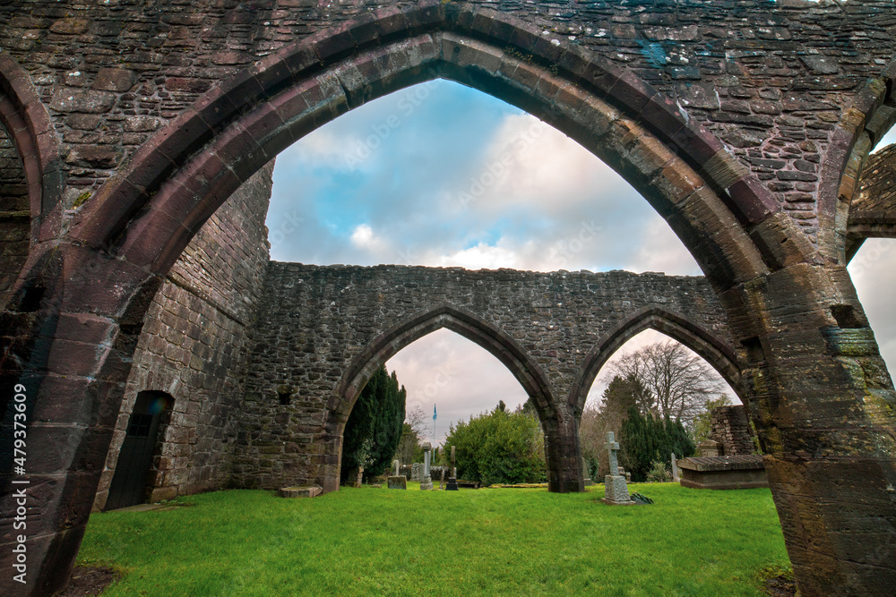 Fototapeta premium Muthill Old Church & Tower. Scotland. U.K is a 12th century medieval church with a tall Romanesque tower, all that remains of an important early Christian site linked to the cathedral at Dunblane. 