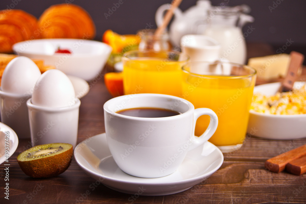 Cup of coffee, juice, eggs, fruits, toasts. Breakfast concept. Cup of coffee, juice, eggs, fruits, toasts. Breakfast concept.