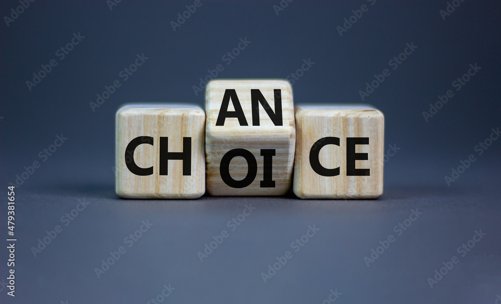 Choice and chance symbol. Businessman turns the wooden cube and changes the word choice to chance. Beautiful grey table, grey background, copy space. Business and choice and chance concept. Choice and chance symbol. Businessman turns the wooden cube and changes the word choice to chance. Beautiful grey table, grey background, copy space. Business and choice and chance concept.