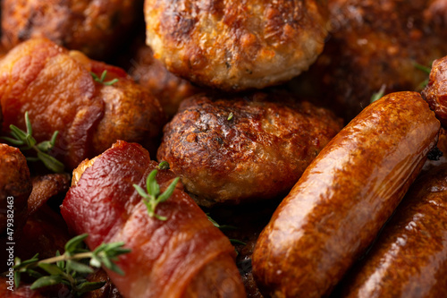 Pigs in Blankets, cocktail sausages and meatballs on plate. Party food