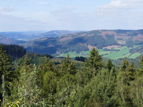 View from the circular path of the Glinge pumped hydroelectric energy storage, North Rhine-Westphalia, Germany, of the mountains and forests of the Sauerland Blick vom Rundweg des Speicherwerks Glinge