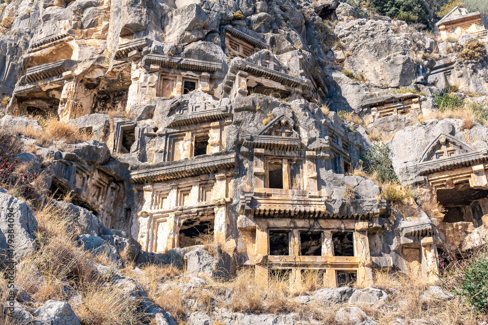 Obraz premium ruins of a rocky necropolis with stone-cut tombs in Myra Lycian (now Demre, Turkey)