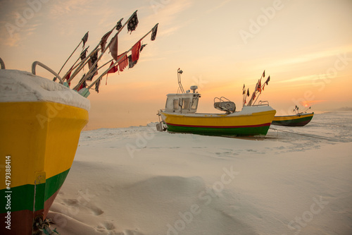 Fototapeta Naklejka Na Ścianę i Meble -  Podmorskie region, Poland - December, 2010: fishing boats on the beach in the winter, Baltic sea near Sopot town