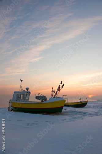Podmorskie region, Poland - December, 2010: fishing boats on the beach in the winter, Baltic sea near Sopot town