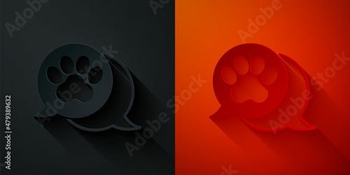 Paper cut Paw print icon isolated on black and red background. Dog or cat paw print. Animal track. Paper art style. Vector