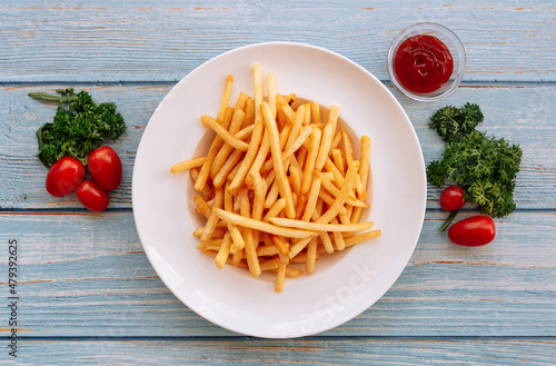 Canvas Print Shoestring French Fries with bbq sauce, Sea Salt and tomatoes in white plate on