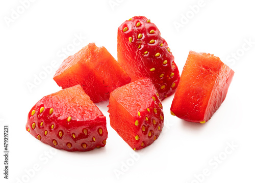 Cut strawberry pieces isolated on white. Chopped strawberry.