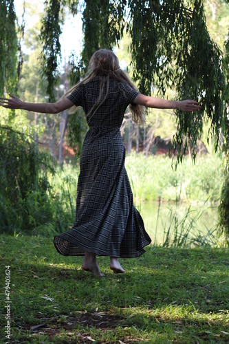 woman spinning in the park