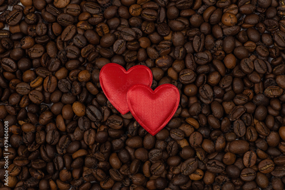 red heart and an inscription of letters on a background of coffee beans. Love coffee concept. St. Valentine's Day. View from above. red heart and an inscription of letters on a background of coffee beans. Love coffee concept. St. Valentine's Day. View from above.
