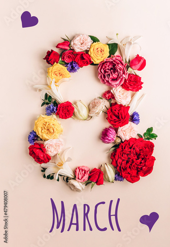 International womens day concept. Assorted flowers in the shape of the number 8 on a light beige background
