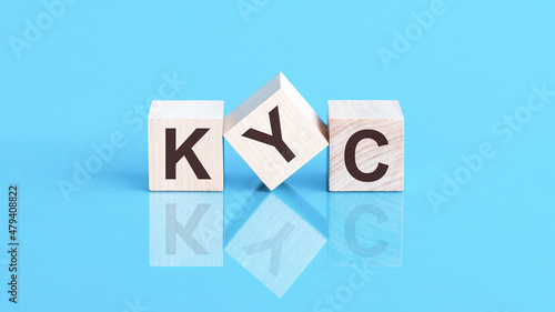 KYC is an abbreviation of the Know Your Customer - the text is written on wooden cubes photo