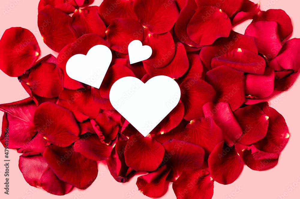 Three paper hearts on real red rose petals message valentine simple design Three paper hearts on real red rose petals message valentine simple design