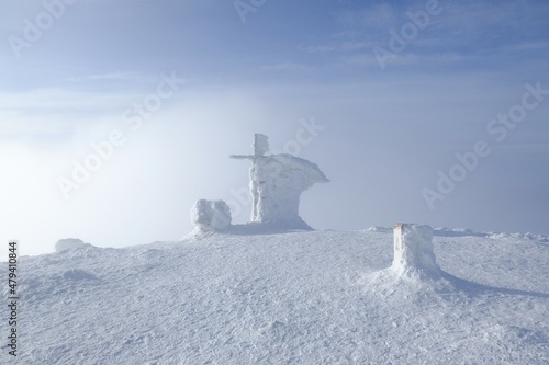 Babia Gora peak in misty winter scenery. Diablak, Babiogorski National Park, Beskid Zywiecki, Poland photo