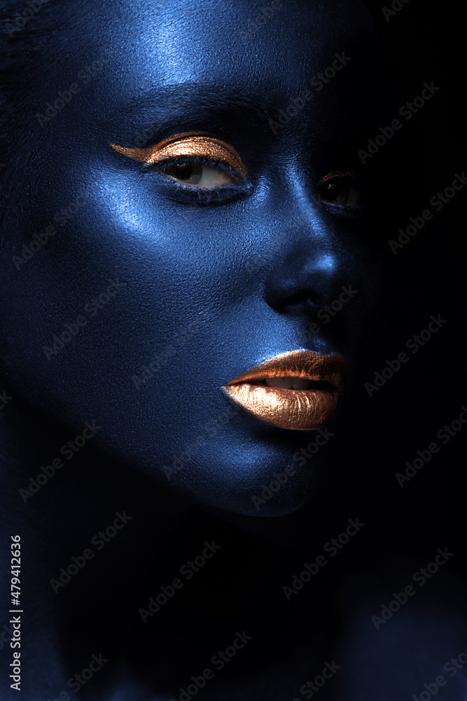 fashion portrait of a blue-skinned girl with color make-up. Beauty face.