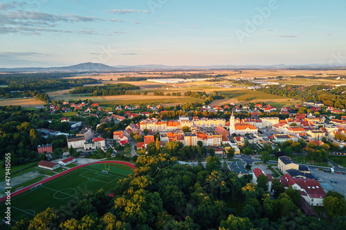 Aerial view of small european town with sradium and sport field