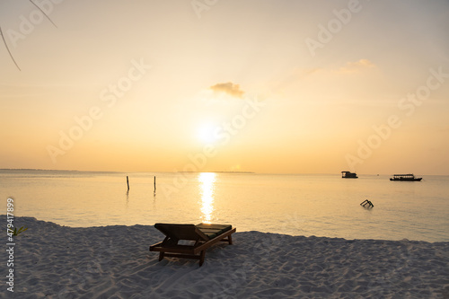 Close-up of sunbeds set on a beautiful tropical beach. Impressive image for every use.