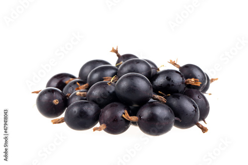 heap of black gooseberries isolated on white