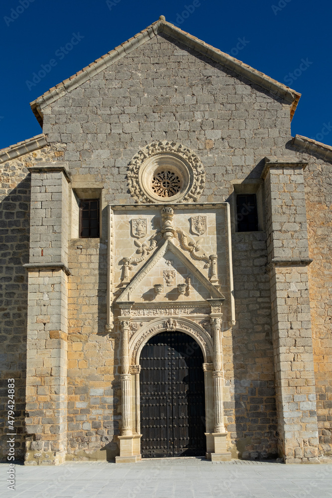 Fototapeta premium View of the Santa Maria la Mayor church in Alcaudete (Spain) on a sunny winter morning