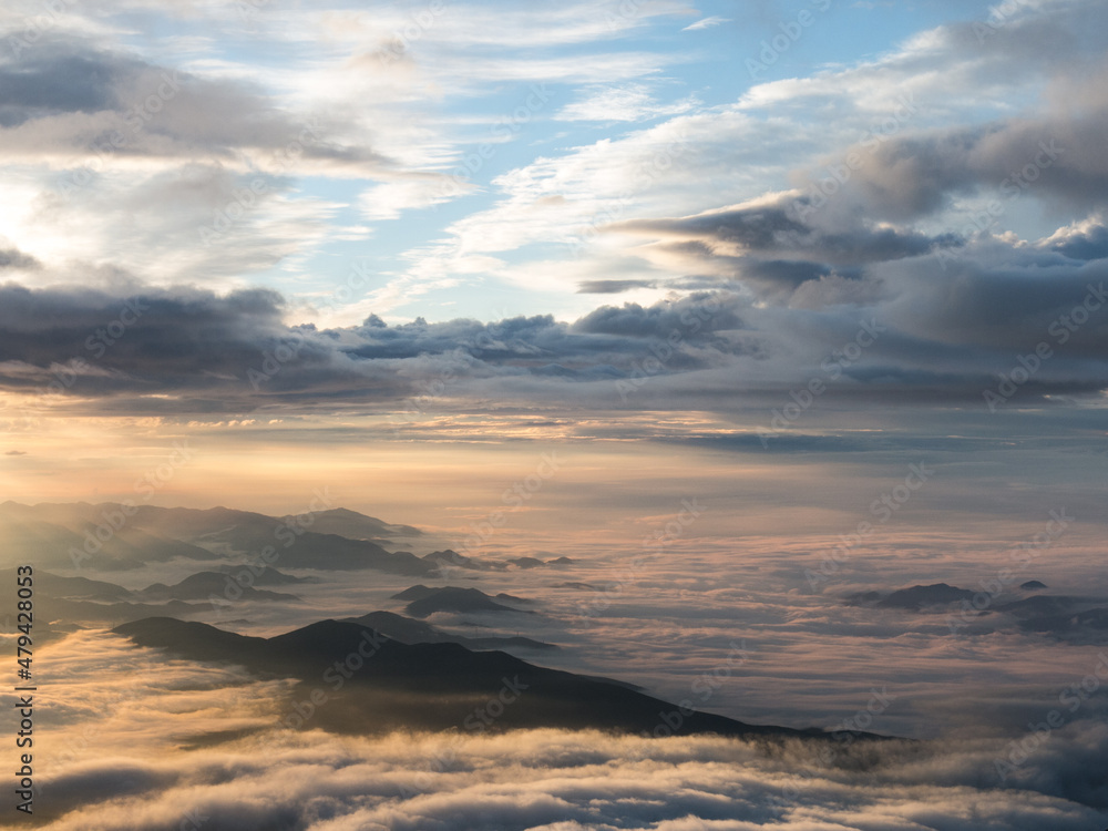sunrise over cloudscape as seen from mount fuji in japan