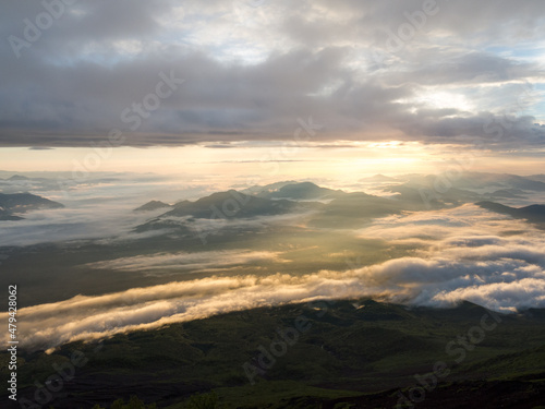 sunrise and clouds over the mountains from mt fuji