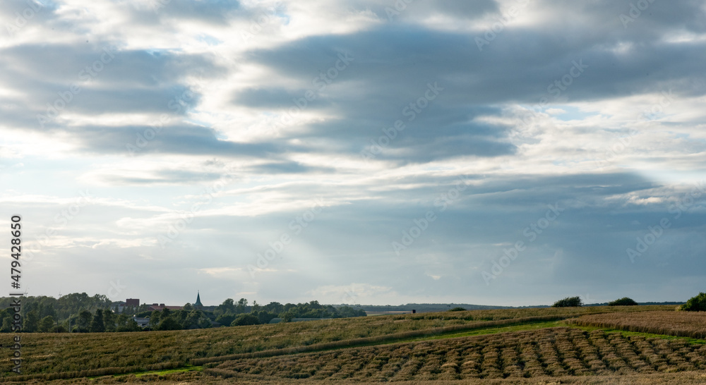 dramatic clouds over field in south sweden