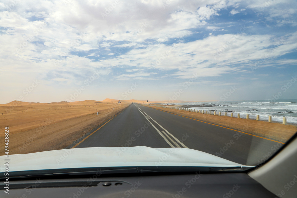 Fototapeta premium View while driving along the yellow sand shoreline of the Skeleton Coast