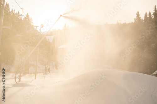 Foto Snow cannon in winter mountains