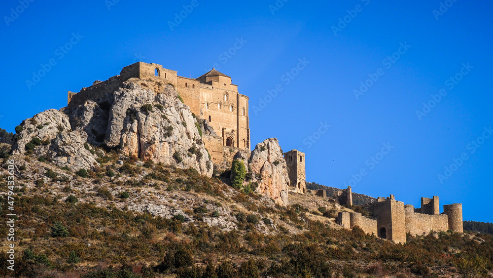 The Castle of Loarre is a Romanesque Castle and Abbey located near the town of the same name in Aragon, Spain. There are great views of the Pyrenees all around it.
