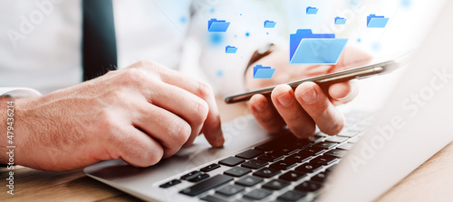 Bilde på lerret Document management system (DMS) concept, businessman using laptop and smartphon