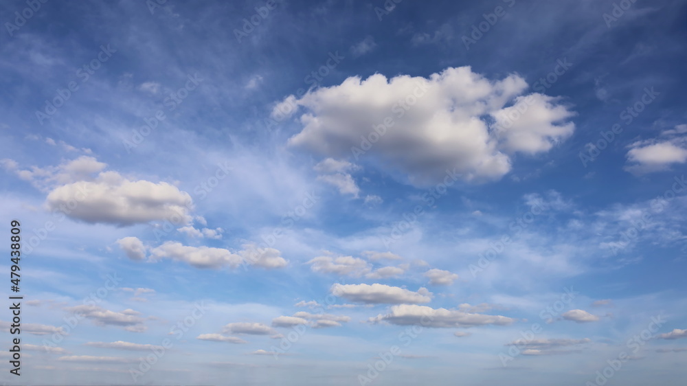 White clouds in the sky. Blue sky background with small clouds Selective focus White clouds in the sky. Blue sky background with small clouds Selective focus