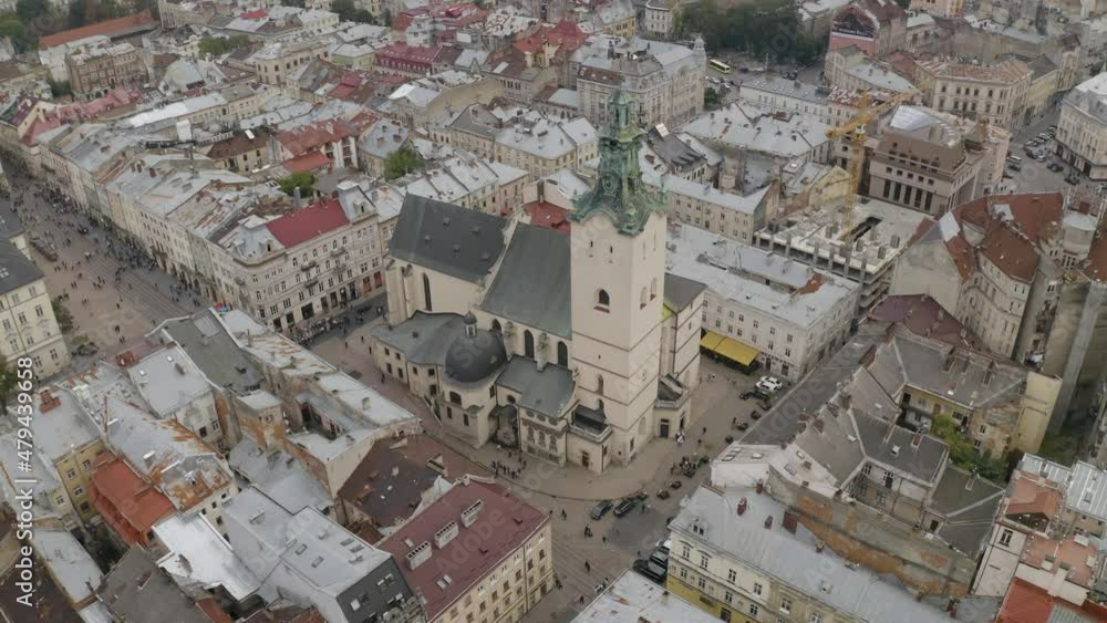 Aerial drone video of Latin Cathedral, city Lviv, Ukraine. Flight above roofs, streets. Panorama of ancient popular central part of old European town Lvov, Ukraine. Rynok Square, Central Hall, Ratusha Aerial drone video of Latin Cathedral, city Lviv, Ukraine. Flight above roofs, streets. Panorama of ancient popular central part of old European town Lvov, Ukraine. Rynok Square, Central Hall, Ratusha