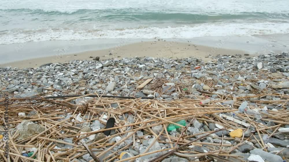 Discarded plastic debris trash pollution after sea swell storm,environmental nature waste Discarded plastic debris trash pollution after sea swell storm,environmental nature waste