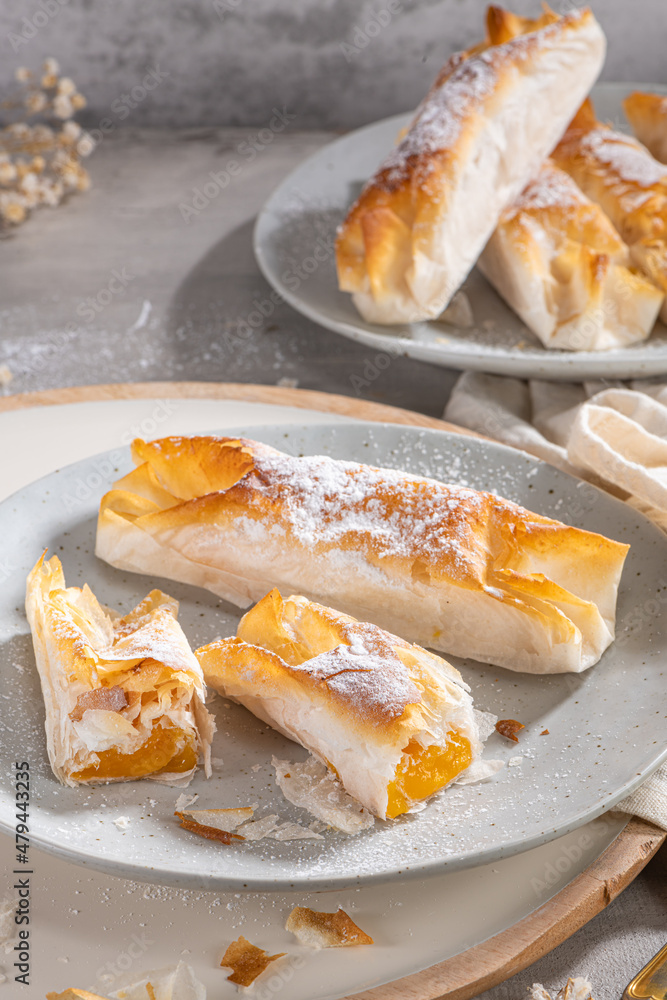 Typical portuguese sweets Pasteis de Vouzela served on countertop. Filo pastry with egg cream filling Typical portuguese sweets Pasteis de Vouzela served on countertop. Filo pastry with egg cream filling