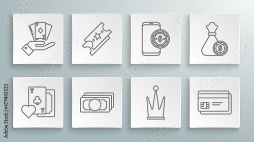 Set line Playing card with clubs symbol, Lottery ticket, Stacks paper money cash, Crown, Credit, Online poker table game, Money bag and casino chips and Hand holding deck of playing cards icon. Vector
