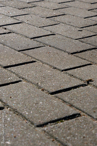 closeup of grey pavement made of rectangular paving stone, texture, background