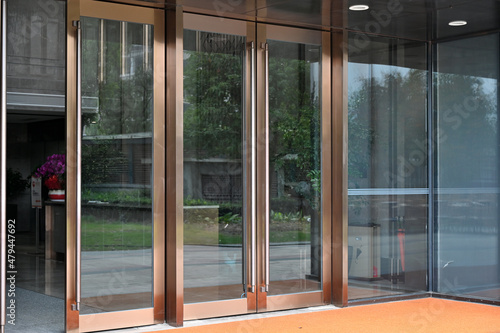 A glass door at the entrance to a commercial building