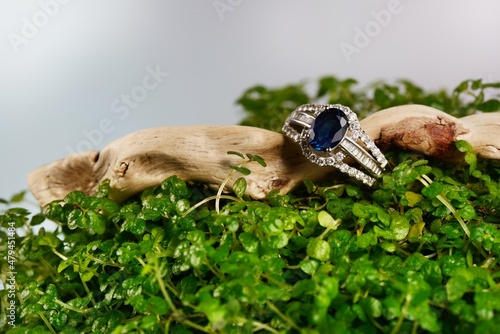 Women's platinum ring with a diamonds and blue precious sapphire jemstone photo