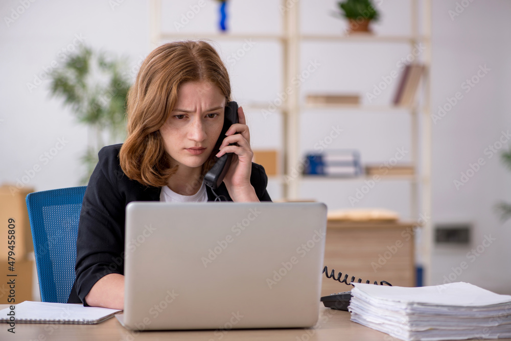Young woman working in box delivery service Young woman working in box delivery service