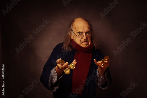 Scrooge having too much gold coins to hold in his hands, wearing a scarf Fototapet