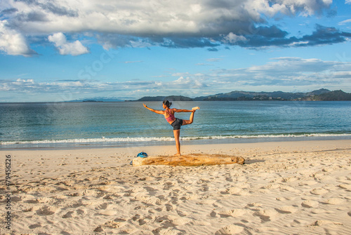 Yoga on Playa Conchal, a beach made of seashells, Guanacaste, Costa Rica photo