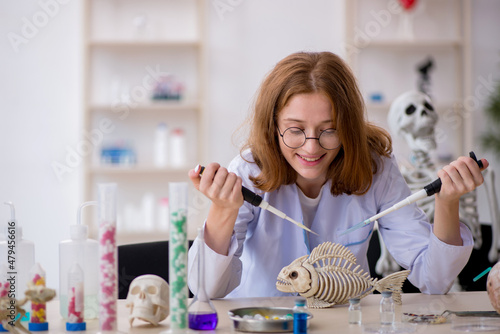 Young female zoologist working at the lab photo