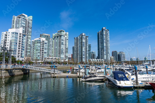 Vancouver city  BC  Canada - April 5 2021   Yaletown dock marina  downtown apartment skyline reflection on the water.